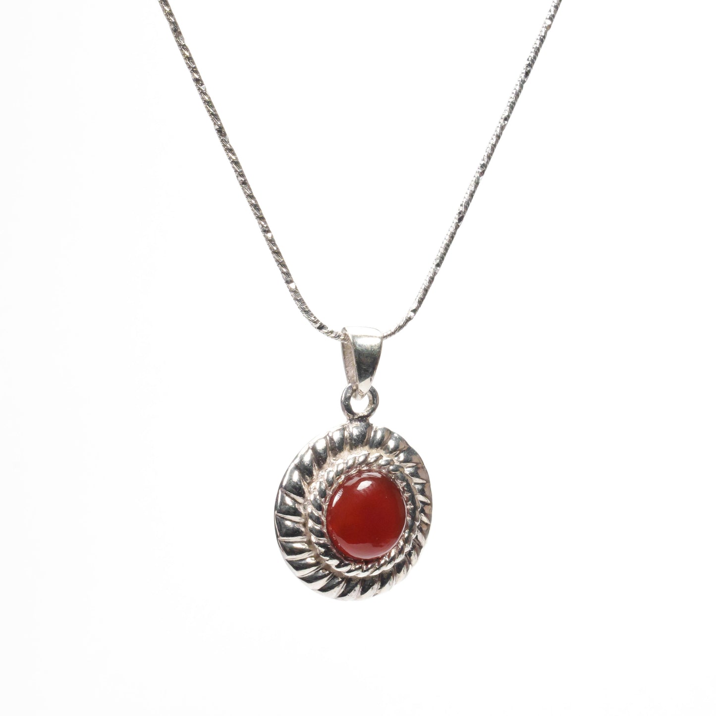 sterling silver red stone twist pendant in side view